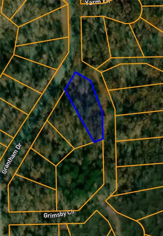 Located in the scenic Lincoln Subdivision of Bella Vista, this 0.32-acre lot offers a peaceful cul-de-sac setting surrounded by nature. Situated on Grimsby Circle in Benton County, this property lies within the highly regarded Bentonville School District and provides convenient access to Bella Vista’s renowned trail systems, lakes, and golf courses. With no timber acreage and a quiet, wooded environment, it’s an ideal spot to build your dream home or hold as a long-term investment.