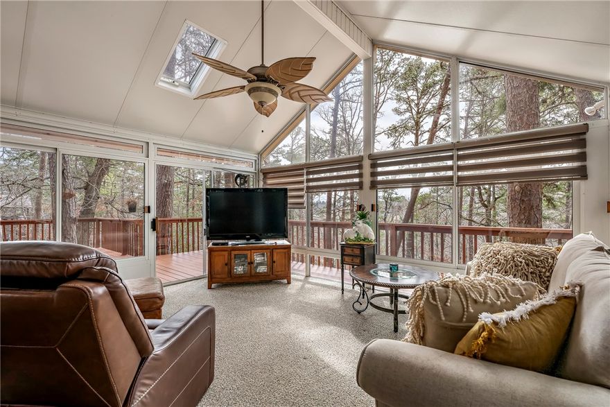 Welcome to your own private retreat situated among the trees, minutes from Beaver Lake and 12 minutes to DT Rogers. This charming 3-BD, 2-B home offers comfort, character, and natural beauty on a wooded lot with a seasonal lake view. Inside, you’ll find LPV flooring, abundant natural light, and a cozy wood-burning stove. The entryway features a soaring ceiling and staircase, creating an open, welcoming feel. A standout feature is the sunroom, surrounded by windows and treetop views, offering an additional 235.7 sq ft (not included in total heated sq ft )perfect for relaxing/entertaining. Step outside to multi-level decks built around mature trees creating a unique outdoor experience. Storm shelter in garage. While there is no direct lake access, you’ll enjoy a seasonal view of Beaver Lake and the peaceful setting that comes with it. If you’re looking for a home that feels like a getaway while still being conveniently located near Rogers and the lake, this is a must-see.