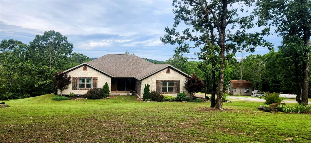 Stunning Retreat features panoramic sunset views and a newly updated guest cabin. Discover your dream home with this beautiful and spacious property tucked away in a serene settingājust minutes from the heart of Huntsville. Step inside to an open-concept kitchen featuring stainless steel appliances, gas stove, two dishwashers, and a large walk-in pantry. The living room offers a gas fireplace. The master suite includes a jetted tub, walk-in shower, plumbing for dual vanities, and a generous walk-in closet. Two additional main-floor bedrooms share a Jack-and-Jill bathroom. The walk-out basement features a spacious media room with a wet bar, full bath, two additional bedrooms, a storm shelter with 8-inch concrete walls, and plenty of storage. A large deck offers a gas hookup for a grill and TV outlet. The fenced backyard includes a chicken coop, and garden space for your vegetables. The guest cabin is a charming retreat of its own, with a kitchen, full bath, w/d hookups, wood stove, full