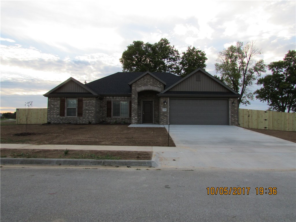 Brick 3 bedroom, 2 bath, pantry, gas log fireplace, split floor plan, open floor plan, covered back patio, covered entryway, privacy fenced backyard, landscaping, guttering on front and back of home.