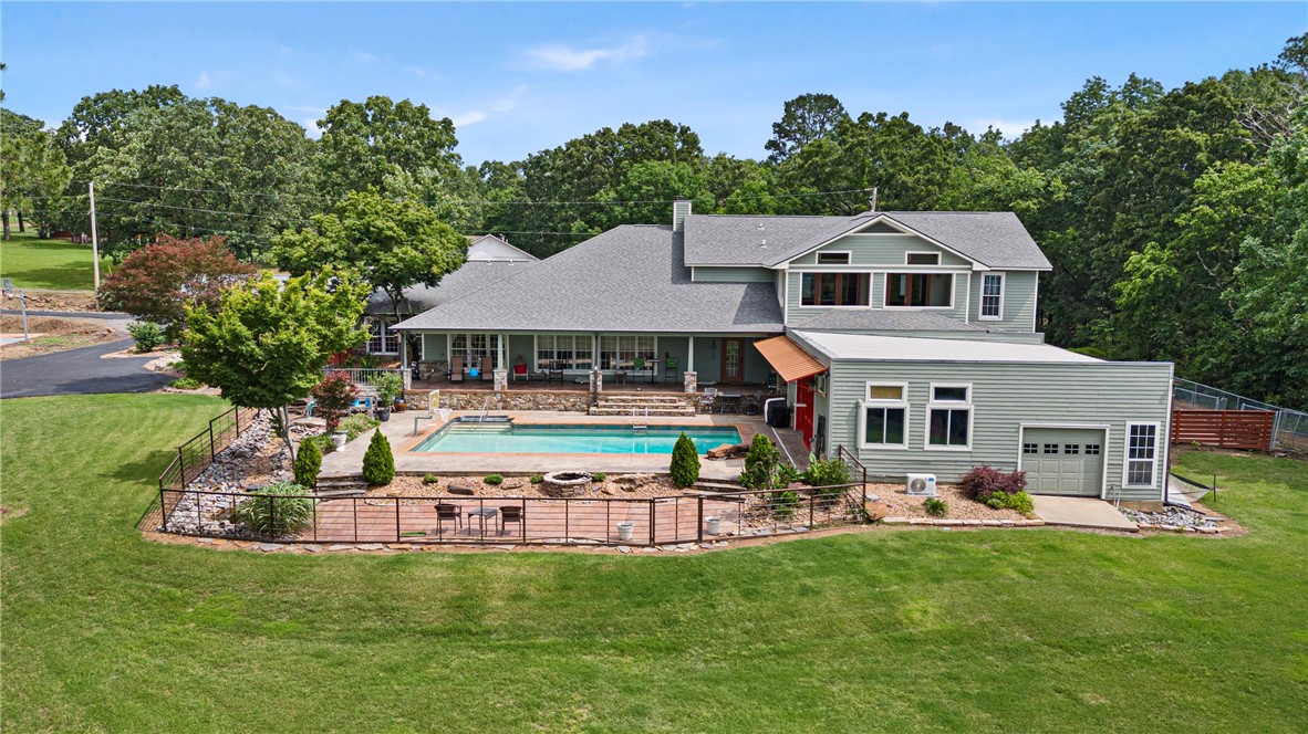 Welcome to this stunning 5-bed, 4-bath estate offering 7,200 square feet of luxurious living space, perfectly situated on 5 private acres at the end of a quiet dead-end road. This property boasts a million-dollar view that will take your breath away, complemented by a sleek modern-industrial kitchen designed for the serious chef, complete with top-of-the-line appliances & stylish finishes. Outside, you’ll find an impressive 1,000 square foot pool house with its own kitchen — ideal for entertaining guests or hosting unforgettable gatherings — plus a detached shop for hobbies, toys, or additional storage. The home is equipped with 3 geothermal HVAC units for efficient, eco-friendly comfort throughout the year. Whether you’re relaxing by the pool, enjoying the panoramic views, or simply soaking in the privacy and space, this estate offers the perfect blend of luxury, functionality, and peace. Homes like this are rare — don’t miss your chance to own this incredible retreat! Can also be purchased w/ 32 acres.