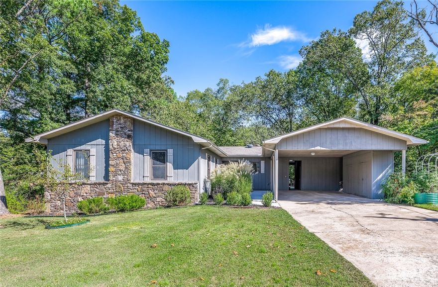 Welcome to your next home!  Just under half an acre with a park-like setting and  FLAT backyard. The patio is perfect for entertaining and watching the birds! Inside features 3 bedrooms, 2 bathrooms  with a  open concept living area and kitchen, ventless gas fireplace, light filled sunroom and wet bar perfect for your coffee or tea station. Enjoy the large workshop. The covered two car carport could easily be converted to a 2 car garage. Already connected to city sewer! Water heater- 2024, New roof to be installed at closing.  The two garden beds do not convey. See attachments for more upgrades and information.