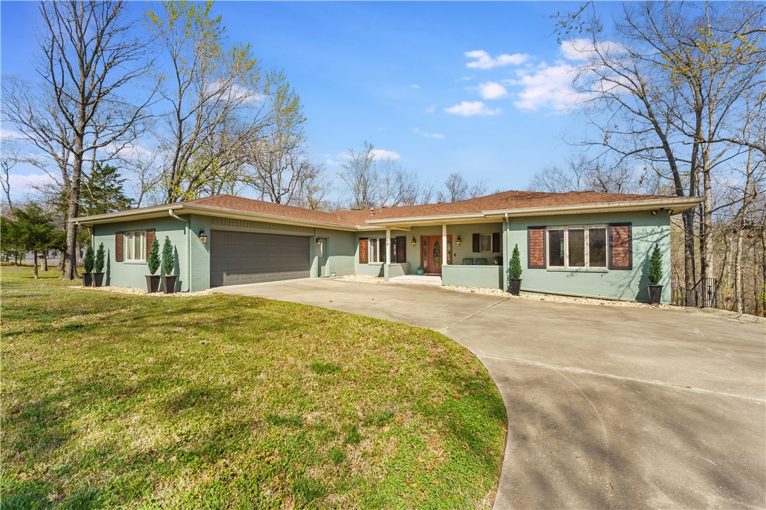 Welcome to The Huskins Home offering you a blend of comfort, charm & endless possibilities. Recently Renovated, this home provides you 3Beds, 3/2.5Baths, 4,000sqft, 1.14ac sitting on 3 parcels providing you w/ natural privacy & making The Huskins Home like no other in Bella Vista! The 1st level invites you in w/ oversized windows allowing natural light to brighten every room. There's 2 Primary Suites & 2 1/2 baths, Formal & Casual Living rooms, Formal & Casual Dining areas. Spacious Kitchen w/ plenty of cook space for all to enjoy. Laundry room doesn't hold back & there's a F.place on each level. Walk into your screened in Sunroom for all day every day relaxation & comfort. The Lower Level provides add’l Living to utilize your imagination or hobbies. You'll also have plentiful storage & walk out access to the backyard to garden or sit by the firepit. Minutes away find Highlands Rec, Branchwood Trl & the Bypass for easy accessibility to all NWA has to offer.
Roof replaced 20'/HVAC 22'/Newer W. Htr./Garage is 24x24