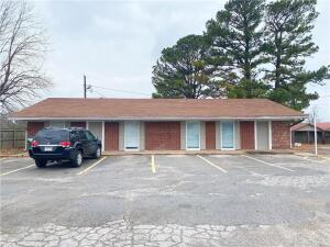 If you're looking for a great location close to I-49 and all the amenities that come iwth it, this property might be the perfect one for you. Located near I-49, restaurants, gas stations, and Walmart, this building is clean and very well kept. With plenty of parking space, new paint, new carpet, new flooring - perfect for a daycare or small business office space! It has two small offices and a kitchenette as well as 2 bathrooms and a spare room. Property to be ''sold as is''