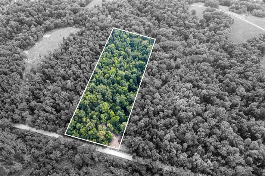 5.37 acres in Bentonville with an out of town feel but within a short distance to the world class amenities Bentonville and Northwest Arkansas have to offer including museums, upscale dining, parks, and biking trails.  With over 5 acres of mature trees and wildlife, room is plentiful to build your dream estate. Located in the sought after Bentonville School district.  Less than 2 miles to I-49 N access, less than 3 miles to Bentonville West High School, 4 miles to Coler Mountain Bike Preserve, and 6 miles to Downtown Bentonville.  Make this natural setting yours and enjoy the benefits of being close but feeling far away.