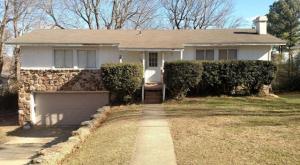 4 bedroom (2 bedrooms in basement don't have closets), 2 bath. Living Room with gas log fireplace. Den in basement. Double garage. Fenced yard. New carpet! Walk-in closet. Storage area in basement. Re-modeled deck. Big shade trees.