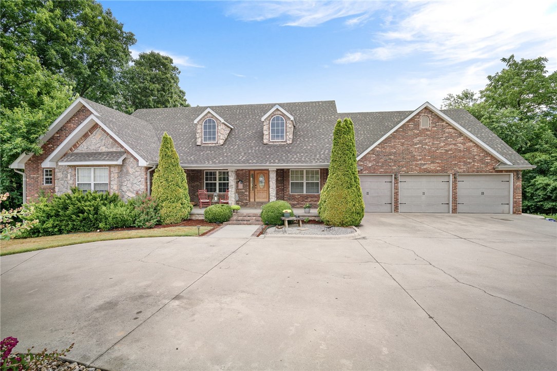 Original custom built home on three wooded acres that provides amble amount of privacy. Immerse yourself in this very highly functional three level home, which features; several entertaining spaces, vaulted ceilings, wood burning fireplace, as well as an additional electric log fireplaces, game room with wet bar, in-ground salt water pool with slide, that ranges between 4 to 9ft, pool bath attached to lower garage, covered back deck that overlooks the pool and the serene nature of the woods, wood burning fire pit. The Primary on-suite offers dual closets & vanities, walk-in tile shower, jetted Jacuzzi. Each of the five bedrooms adjoins a full bath. Whether your interest include, swimming, relaxing, the warmth of the fire, mixology, grilling out, entertaining friends & family, relaxing in the jetted tub, & much more, this home features it all. The downstairs basement can also function as a mother-in-Law Suite. Come experience this high entertaining, yet relaxing retreat like home in Pea Ridge.