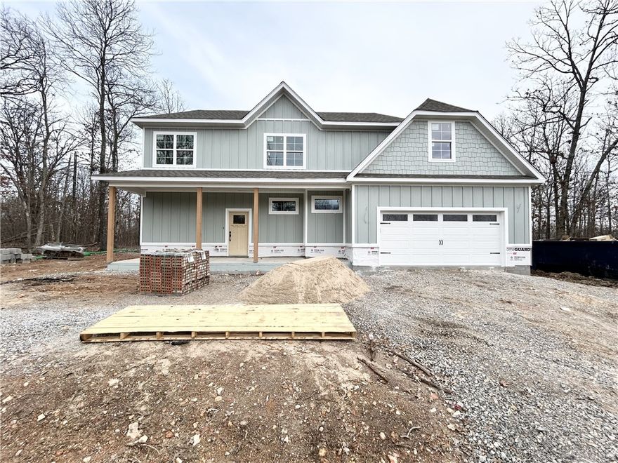 New construction on a FLAT .28-acre wooded lot! (backs up to POA common property) $3,000 in buyer closing costs paid from builder’s preferred lender. This home features 331 sq ft of floored unfinished attic space with easy access (no need for a storage unit!), 2 bedrooms plus an office (primary bedroom on the main level), 2.5 bathrooms, 3 cm granite counters, 10-foot ceilings, custom cabinets, oversized kitchen, gas range, pantry, walk-in tile shower, gas fireplace, built-ins, two covered patios, and high-end finishes throughout! Easy access to the new Bella Vista bypass, Highlands Golf Course, and Loch Lomond! Estimated completion - 3/18