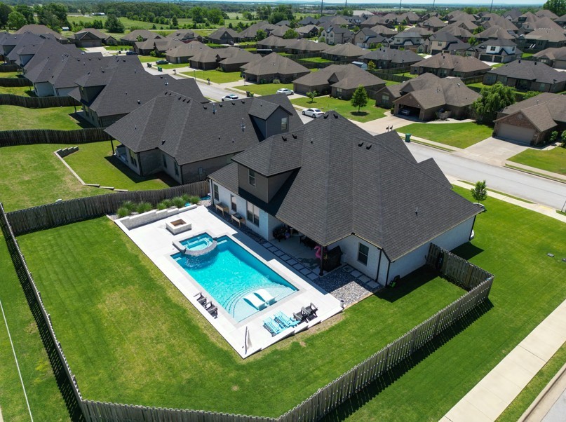 Standout home in Tamarron with a pool, hot tub, and solar power—this one’s got the extras that are hard to find. Set in the Bentonville School District and just minutes from everything, it blends everyday function with a few smart upgrades. Inside, the layout is flexible with 4 bedrooms (or 3 plus a bonus room), 3 full baths, and a great room built for hosting—complete with a floor-to-ceiling fireplace. Tile shower with a rain head, separate irrigation meter, and an ultra-quiet dishwasher round things out. Bonus: solar panels already in place to keep energy bills in check.