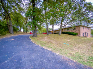 Do you need a large home? If so this is the home for you! Located on the north end of town across the street from the golf course community. It is a great location for golf, shopping, dining, or just a peaceful life. This is an extremely well built home that needs a cosmetic facelift. Home is priced to sell ''As Is'', Seller does not want to remodel...but if you are willing to put in some effort you would enjoy some instant equity. You will love the large master bedroom...and the second master bedroom. Home is 4 bed 3 1/2 baths. Basically paint, floor coverings, and possibly a kitchen makeover is all this home needs, structurally it's in great shape. Check it out quick...I don't expect it to last long.