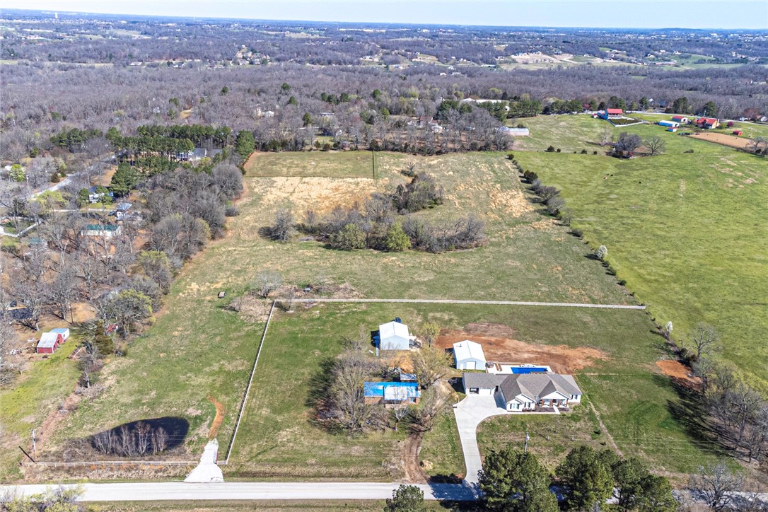NOW FOR SALE! Check out this 13.84 acres +/- located in Northwest Fayetteville! Located minutes away from schools and parks and I-49, and less than 15 minutes away from University of Arkansas campus! Opportunities and potential are endless with this location & acreage! Potential for development! Not interested in developing? Consider using this gently rolling land with a partial split rail fence and pond to build your dream home and operate your hobby farm or cattle/horse pasture! Utilities available at the street! Don't miss out!