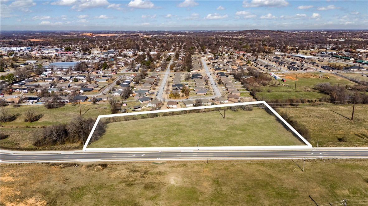 This prime 6.39 +/- acre property offers an exceptional investment opportunity with endless development potential. Ideally located just minutes from I-49, the property will soon benefit from a new road extension connecting it to West Springdale, enhancing accessibility. The level lot features major road frontage and is conveniently situated near shopping, schools, and dining, making it perfect for various developments. The new "Pride of Springdale" multi use trail will border this property on the south along Emma once construction is completed. Additionally, the property is adjacent to the newly proposed pickleball complex, positioning it at the heart of a vibrant and growing community. Essential utilities, including water and sewer, are nearby. Don't miss the chance to invest in this optimal property!