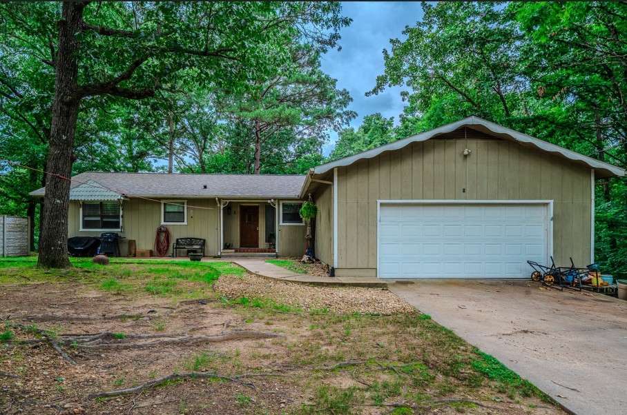 What an opportunity! Come see this huge corner lot home (.44acres!) backing directly up to the Back 40 Bike Trail and ready to make your own! Priced to sell, this 2775sqft 4br/2.5ba house has a new roof (2023), granite countertops, huge walkout basement, ample storage, added hard-surface floors , and a wonderful sun-room overlooking your private wooded backyard. House is priced well below recent appraisal, needs some TLC and is being sold as-is. Motivated sellers.