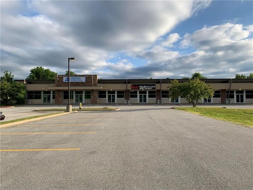 Location, location, location!  This property is seconds from I49 and will only grow in value as Johnson Square continues to develop.  Bentonville is only a short 20 minutes away.  The 10 suites are currently divided for five tenants and can easily be adjusted for six.   The .62 acre grassy area in front is not included yet can be purchased at MLS # 1177805