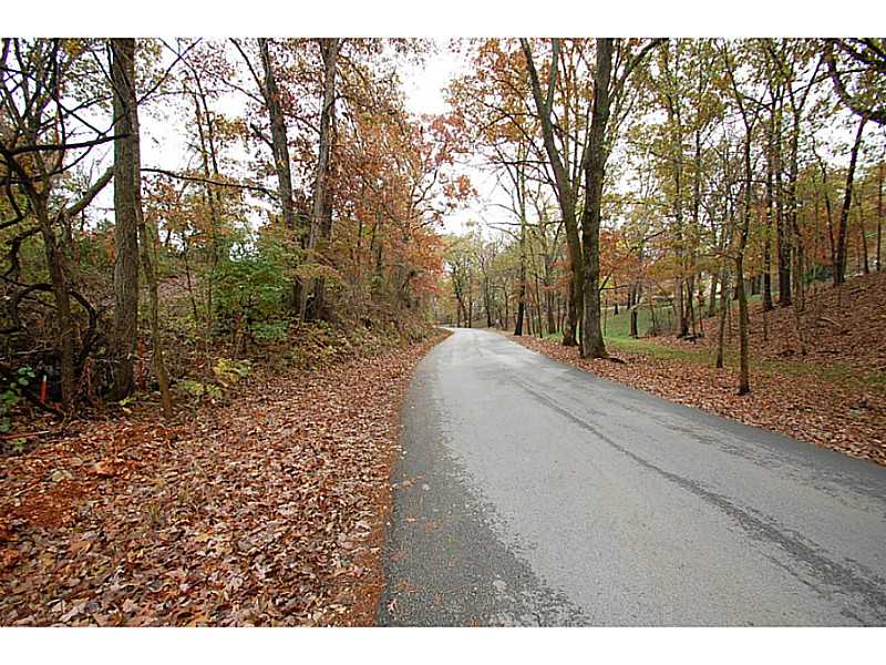 Three acres ready for new home or double wide! Waster, gas, and electric on-site. And, septic from previous home still in place! Large level portion on hilltop makes for the perfect home site!