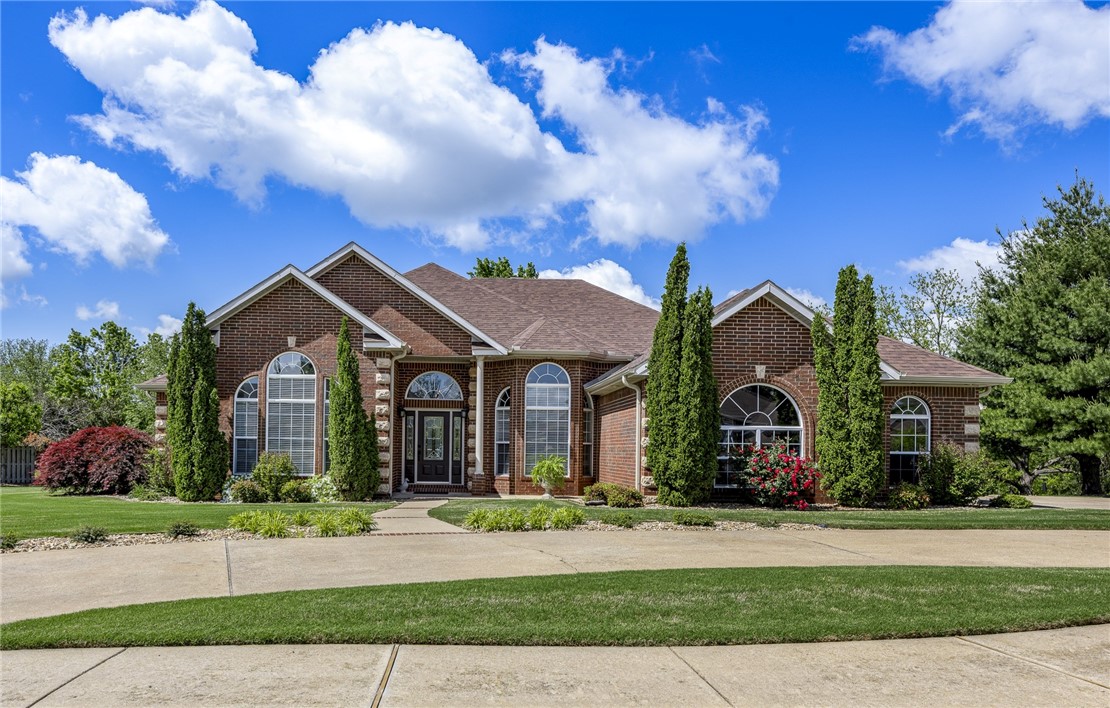 AMAZING LOCATION! Walk or bike to Walmart Campus, Downtown Square, Museums, School of Medicine, Orchard Park, Memorial Park. Very close to Trails & I-49. Exceptionally upgraded new-like home in sought-after Glenbrook Subdivision on .62 acre. Beautiful home! Impeccable condition. All brick, 3 car garage, invisible fence, spacious deck, gorgeous landscaping, wooded backdrop. Abundant natural light. High-end upgrades, new hardwood floors & fresh paint create a sophisticated home, fresh clean relaxing atmosphere, high ceilings. The floorplan allows versatility to enjoy the space based on personal lifestyle; 2 living & 2 dining areas, home office with custom built-ins, 4 bedrooms, 3.5 baths. Over-sized primary bedroom & updated bath offer comfort/luxury with walk-in shower, soaking tub, double vanities, double closets. Updated kitchen is modern & inviting with new appliances, quartz countertops, backsplash, cabinets, lighting. Extra storage cabinets/closets. New garage door & gutters. Roof 2023. HVAC & water heater 2023