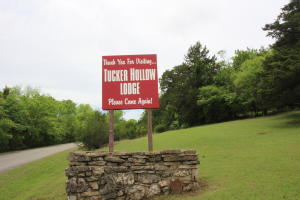 Own your own lodge on the banks of the Bull Shoals Lake! That's right this lodge is on a 10 year renewable lease program with the Corp and is in the State Park at Tucker Hollow. Twelve rentals some with kitchenettes and an Inn Keepers quarters connected to the office and laundry. Only a few hundred feet to the water to launch your boat or swim. Two rooms left to be remodeled. Completely furnished with new mattresses, linens and more. Call today to set up a showing.