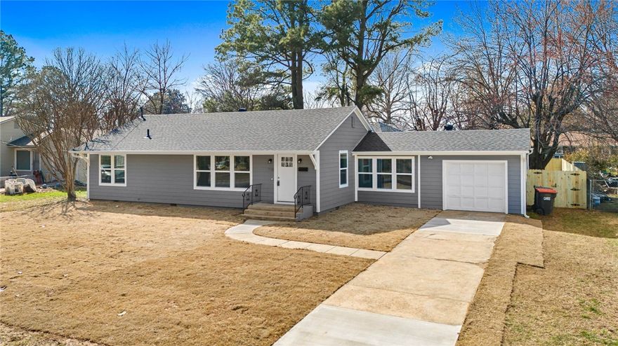 Beautifully renovated home just minutes from downtown Springdale.  This move-in-ready property has been completely updated inside and out, featuring a new roof, Hardie siding, windows, HVAC, water heater, deck, privacy fence and new sod.  The interior has been completely updated as well with new plumbing, paint, fixtures, brand new kitchen and baths and new LVP flooring throughout.  The home offers 3 bedrooms and 2 baths with a spacious open-concept living and kitchen area.  The kitchen features granite countertops, new cabinetry, pantry, stainless steel appliances, plus a convenient bar for extra seating.  A versatile flex room with an attached second bath and laundry is perfect as a 4th bedroom, home office, or hobby room.  Step out back to your brand new deck and large private back yard shaded by mature pine trees.  Don't miss the opportunity to be a part of the thriving downtown Springdale Community.