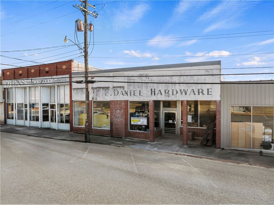 Rare opportunity to purchase a historic commercial building located directly on the town square. This 9,128± total square foot property includes 4,948± square feet of retail space with high ceilings and an open layout suitable for a variety of business uses. The glass storefront looks straight across the square to the county courthouse, providing excellent visibility and steady foot traffic in a prime downtown location. A loading dock is located at the rear of the building for convenient deliveries and operations. Rich in local history, this property has long been part of the community and is ready for its next chapter.

Auction March 21 at 12:00 PM. Bid in person on location or online at www.simsfamilyauctions.com. A nonrefundable 10% buyer’s premium will be added to the final bid price. Closing will occur within 45 days. Read all terms and conditions for full details or contact auctioneer.

Contents of store are being auctioned in two separate auctions on 3/7 and 3/21.
