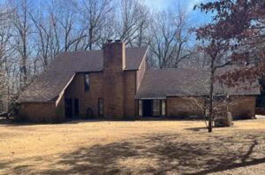 This fantastic home on 20 beautiful Ozark acres is designed for your family to live in, work and play.   Country living yet close to town. House features living/dining room, kitchen/breakfast nook, bathroom and 2 bedrooms on main floor. Main suite and office located upstairs. Family room, full bath, pantry and workspace downstairs.  New hardwood floors, 3 heat sources, Ceiling fans throughout, Hand crafted oak trim and stairway, classic foyer, central vacuum system, large breezeway and covered back deck, 2 car garage.  Brick and western cedar exterior, in-ground pool, outdoor shower, firepit area, 8 acres of level pasture with pond and garden spot, 12 wooded acres with deer stand. Steel pipe and barbed wire fencing over entire 20 acres, Abundant timber and wildlife. (see private remarks)
