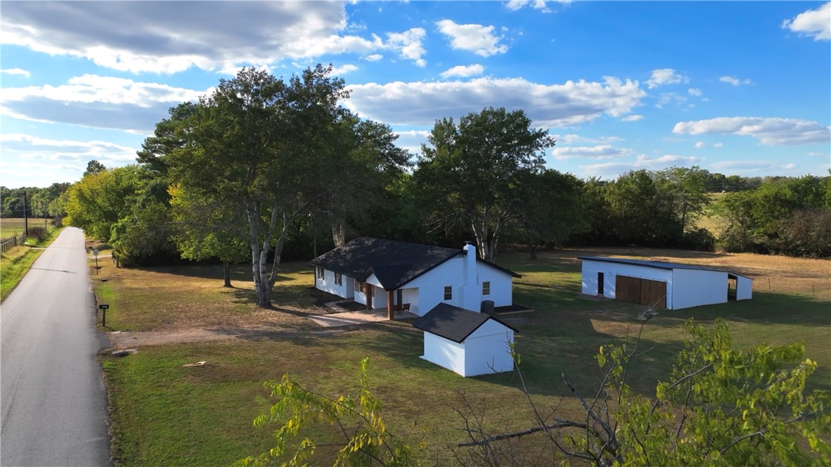 This charming home is perfect for your family and farm. True country living without being miles away from civilization. This completely remodeled beauty has everything you need. Mature trees providing shade for the kids to play, a creek to unwind at the end of the day, pasture for livestock. 2 living rooms, beautiful kitchen, and dining with lots of natural light. As you step inside, you're greeted by a spacious open-concept living area bathed in natural light, thanks to large windows that frame picturesque views of the surrounding greenery. The heart of the home is the gourmet kitchen, equipped with stainless steel appliances, quartz countertops, and ample cabinetry, making it a chef's dream. The master suite is a peaceful retreat, complete with a luxurious ensuite bathroom featuring a tub to soak in and dual vanity. Additional bedrooms are generously sized, perfect for family, guests, or a home office. This home truly offers it all. Donāt let this opportunity slip away, come experience the magic for yourself!