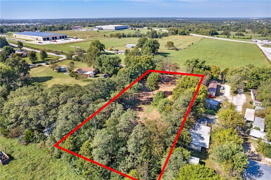 Available for the first time is a prime location on Old Wire Road offering excellent visibility and frontage in a high-traffic area.  This property features flat, level terrain with easy access to Hwy 265 and Hwy 264. Water, electric, and gas utilities already on site making this a convenient and truly ready-to-build location.  Nearby properties have been recently developed into commercial and industrial uses signifying long-term investment potential.  Whether you are looking to build, establishing a business, or a buy-and-hold investor, this parcel provides a rare opportunity.  Seller can build to suit.