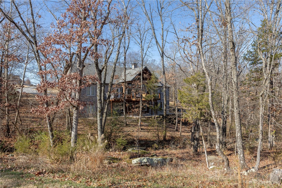 Incredible opportunity to own a beautiful home in a cul-de-sac of East Fayetteville’s highly sought after Overton Park S/D. 5,246 heated sq ft includes 5 bedrooms, 3.5 bathrooms, open kitchen to living, dining, separate laundry, mud room, theater room, study, and amazing bonus room. Over 2,600 sq ft are on the main level and offer 3 of the bedrooms as well as 2.5 bathrooms! Amenities include spa like primary bathroom with soaker tub and dual shower heads, wet bar, quartz counter tops, gorgeous floor to ceiling windows, poured concrete safe room, invisible fence, engineered hardwood floors, 120” built in theater screen, tankless hot water heater, outdoor kitchen, covered patio, and oversized 2 car garage. All of this is situated on a 0.78 lot with mature trees and a creek that flows year round! Zoned for Vandergriff Elementary School. Seller OFFERING $10,000 toward BUYER'S closing costs with accepted offer!!!!!