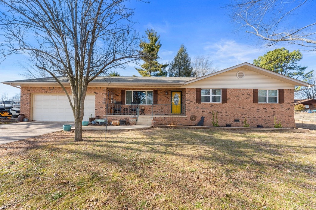 All brick, 3 BR 2 BA, beautiful home located in Southern Hills just off Hwy 7 South - only a few minutes from Harrison. This home features many updates; new roof in 2024, new windows in 2023, new septic in 2019, new HVAC system in 2020, new garage door in 2021, and more! This is a wonderful family friendly home, in a family friendly neighborhood, that sits all on one level with a large fenced in back yard, covered front and back porches and includes an outbuilding.