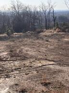 COMMERCIAL TRACT. Property is ready to build on with all utilities at the street. Seller has leveled off about 1 acre at the top to put any type structure on that the buyer chooses. The view of the River Valley from the front entrance of any building will be beautiful.