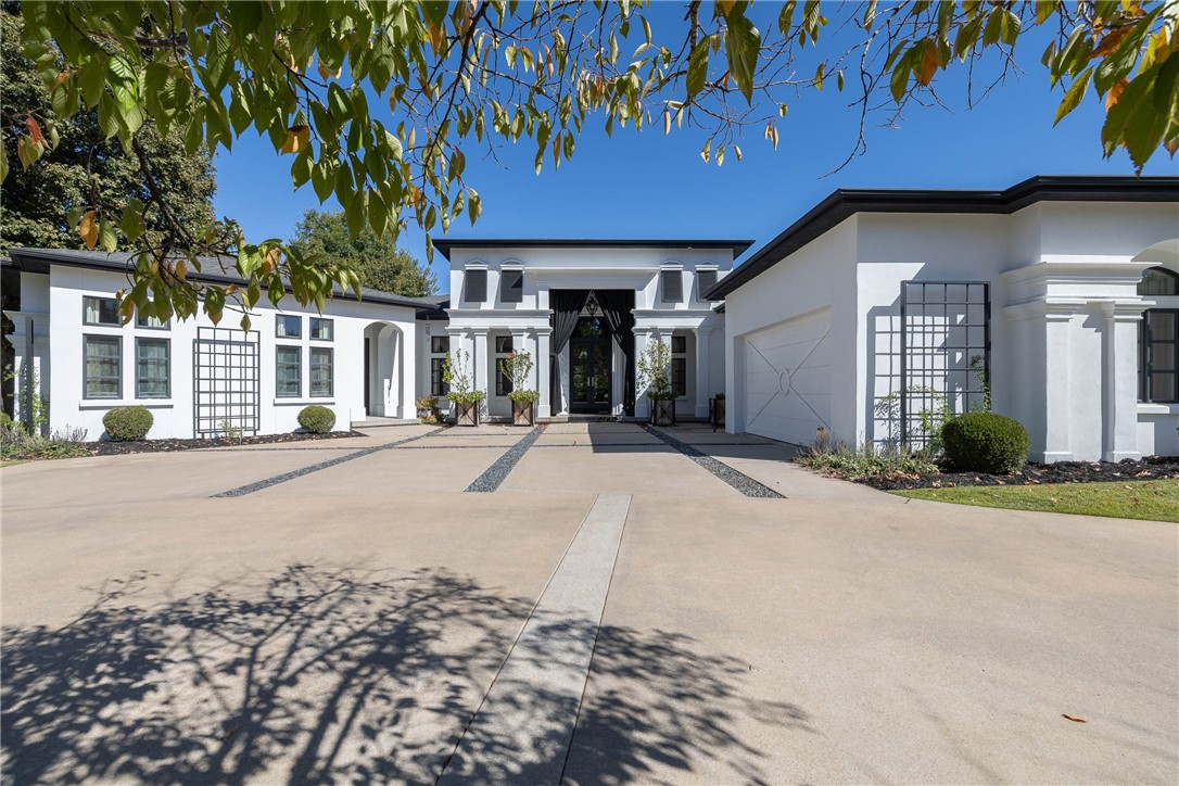 Step into luxury with this stunning contemporary 3-bedroom, 3.5-bath home, where every detail exudes style & sophistication. The breathtaking entry leads to a spacious living room & formal dining room, featuring two gas fireplaces, open floor plan, and unique lighting fixtures throughout. Modern kitchen dazzles with high-end stainless appliances, quartz & marble countertops, two islands, walk-in pantry, & wine cooler. Ownerās suite offers a relaxing sitting area & a luxurious bath with a clawfoot tub & walk-in steam shower. Additional main-level bedroom suite, plus a dedicated office with built-ins. Downstairs, youāll find a bonus room with a gas wood/hybrid fireplace, wine bar, & third bedroom & bath. Outside, enjoy professionally landscaped grounds & multiple deck areas overlooking the 10th hole of beautiful Blessings Golf Course. Recent updates include new exterior stucco, new HVAC, and with amenities galore, this home is fabulous inside & out! Located in the gated community of Clear Creek with private security!