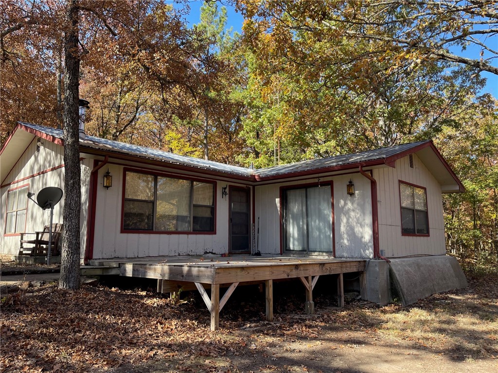 This lake area home boasts a secluded setting with loads of potential on 19 acres mol! Plenty of room to expand, enjoy your privacy, or great hunting. Two parcels are included, home and 5.37+/- acres & an additional 13.63+/- acres. Home has metal roof, wood look ceramic tile in kitchen and bathrooms, carpet, and concrete floors in mudroom. Pellet stove works off of thermostat. Property includes two detached buildings, approx. 864 sq ft shop & a approx. 76x40' "rabbit house" that has been used for storage. Not far from Hwy 62 but only 12 minutes to Lost Bridge Marina and back to Rogers/Bentonville. Property is being sold AS-IS. Termination of previous contract was at no fault of the sellers.