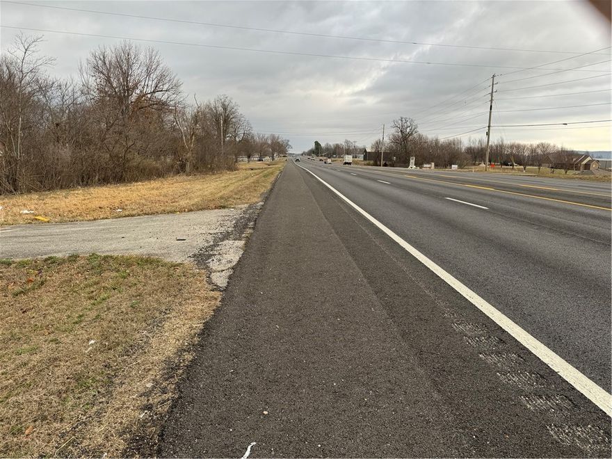 Great piece of commercial land between Farmington & Prairie Grove. Appx 265' of Hwy 62 frontage & appx 930' deep. Endless possibilities for commercial. Old building on property is of no value. Enter at your own risk. First time on the market in over 60 years. Piece this big is getting hard to find at this price