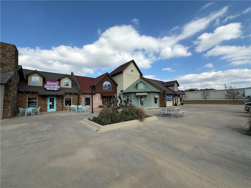 Prime retail space in Farmington Village — a uniquely designed shopping center with European storybook architecture located right in the center of town on Main Street. This 1,014 SF suite features Main Street frontage and backs to Creekside Park. All other spaces in Farmington Village are long-term lease tenants including a spa, ophthalmologist, physical therapy clinic, and counseling practice. 57 parking spaces with ample lot parking. Farmington is one of Arkansas's fastest-growing cities with 38% population growth since 2020 and 260+ new homes permitted in 2025. Walking distance to Farmington schools (2,900+ students), 0.3 miles to Walmart Neighborhood Market. Just 5 miles to the University of Arkansas, 7 minutes to I-49, and 10 minutes to downtown Fayetteville. Sign allowed. $2300 Per Month + $150 CAM