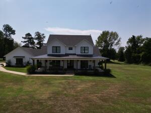 Boasting 4 spacious bedrooms, 3.5 baths, walk in closets and a three car garage this home provides an ideal blend of comfort and luxury. The open-concept living area seamlessly connects to a modern eat in kitchen, ideal for entertaining. Spanning 6 acres of beautifully maintained land, combines privacy with the convenience of Russellville. Don't miss this unique opportunity to own a one-of-a-kind first time offered property in a location that truly has it all.