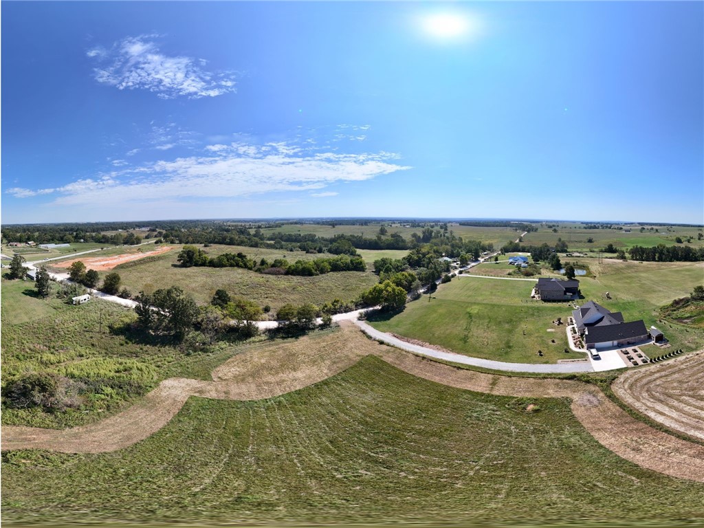 Beautiful 2-acre residential lot just minutes from everything! Approved perc test and septic plans for a 3,500 sq ft home already in place, with potential to build one large estate or two homes. Water available across the street. Located only 4 minutes to XNA and Hwy 612 expansion, this property offers unmatched convenience while still providing a peaceful country feel. Zoned residential, itās the perfect canvas for builders or anyone wanting space to create their dream home. Enjoy wide-open views, stunning sunrises and sunsets, and the freedom to build your vision in a prime location.
