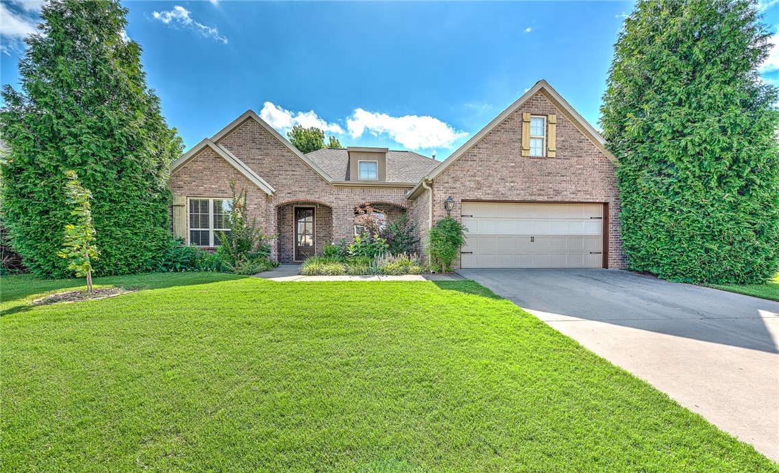 Located in the highly sought-after Lexington Subdivision in Southwest Rogers, this beautiful one level home offers 3 bedrooms/2.5 baths and features lots of great updates and amenities! The park-like backyard offers a peaceful retreat with a roomy covered patio, lush landscaping and gardens, and a whimsical playhouse perfect for kids! NEW ROOF will be added this week! Gleaming solid hardwood floors flow through the main level and in all bedrooms, complemented by fresh, brand-new paint throughout the home. The spacious living room features high ceilings and a cozy fireplace, while the kitchen offers newer stainless appliances! Enjoy a spacious formal dining room and a dedicated private office-perfect for working from home. Beautiful and private master retreat with luxurious en-suite bath and chic custom closet! Heated and cooled attic space that is easily accessible from the garage! Newer AC & water heater! Short walk to Fairway Elementary and just minutes from I-49, Walmart AMP, restaurants, shopping and more!