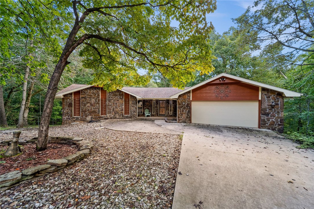Tucked away at the very end of a quiet cul-de-sac, 7 Ottery Lane offers unmatched privacy and peaceful living on 1.24 wooded acres. With no through traffic and no nearby neighbors, this property is truly a rare find in Bella Vista.
Spanning 3,400 square feet, the home features a thoughtfully designed layout with 2 spacious living areas and 3.5 bathrooms. Expansive living areas and oversized windows bring in natural light while offering views of the surrounding trees, making the indoors feel just as serene as the setting outside.
The home’s secluded location provides the perfect balance—private and tucked away, yet just minutes from Bella Vista’s lakes, trails, golf courses, and amenities. Whether you’re seeking a peaceful retreat, a place to entertain, or room to expand, this property delivers the space and seclusion that are hard to find.
Don’t miss the opportunity to own this one-of-a-kind home at the very end of Ottery Lane—where privacy, space, and nature meet.