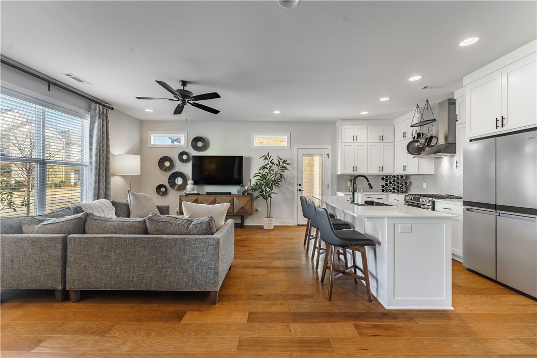 Enjoy all that North Fayetteville has to offer! This meticulously cared for modern brick home is located just south of Lake Fayetteville and provides easy access to walking & biking trails, boating, swimming, and tons of outdoor activities at the Lake Fayetteville Park & the Botanical Gardens. The open concept living space lends perfectly for everyday living and entertaining. Beautiful wood floors and natural light flow throughout the home. Modern kitchen features white cabinets, Quartz countertops, 5-burner gas range, stainless steel appliances, vented hood and pantry. The primary bedroom is on the main floor with wood beams & walk-in closet and the primary bathroom features two sinks & a sleek tile shower. Upstairs find two large bedrooms, each with a walk-in closet, and a secondary bathroom with two sinks & a tub/shower. Access a side patio off the kitchen & a back door through the large laundry / mudroom. Expansive attic storage space is above the insulated 2-car garage. Showings start on Wed, Feb 5.
