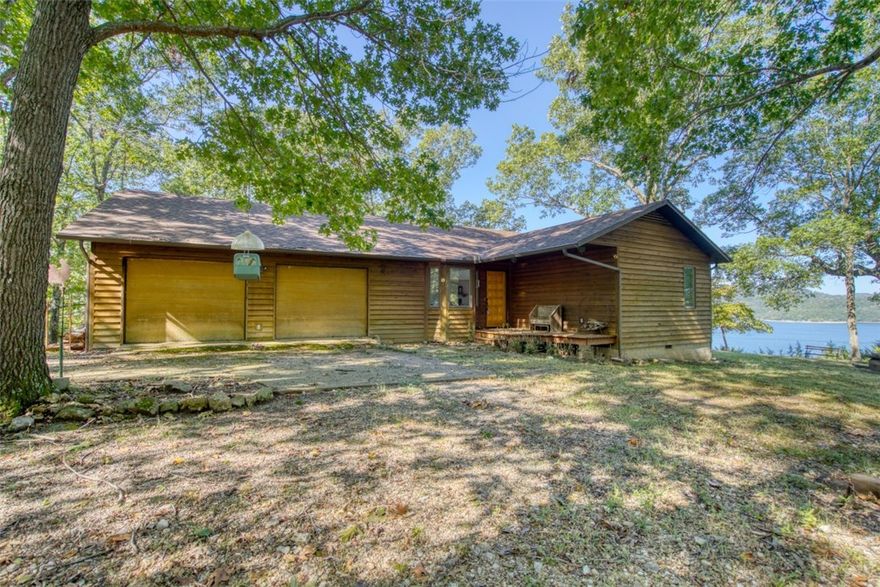 It&#x2019;s tough to capture in pictures how amazing this house and 26.5 lake front acres are. Over 2000&#x2019; of Corps-line frontage with about half of that being in the water, house size boulders, three story cliffs, gated privacy with no other houses in sight, 180 degree lake views, amazing sunsets, and tons of room for trails and exploring! The house is clean and well maintained with large windows throughout. Nice homes in the area, paved road access, and the home is only a little over a mile from Starkey Marina!