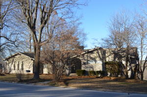 Huge 5-bedroom 4 bath home with a spectacular city view! This home features a formal sitting room, a family room with a gas burning fireplace and a den for your pool table downstairs. There's not one but two master bedrooms on the main floor plus two more bedrooms. Then, there is a fifth bedroom downstairs that could also be a fantastic home office. There is a giant shop area downstairs and lots and lots of storage. From the kitchen you can step out onto a very large back deck. Perfect for grilling and entertaining guests. One of the master bedrooms has its own private deck. This home needs some updating but has a ton of potential to be one of the premier homes in Harrison.