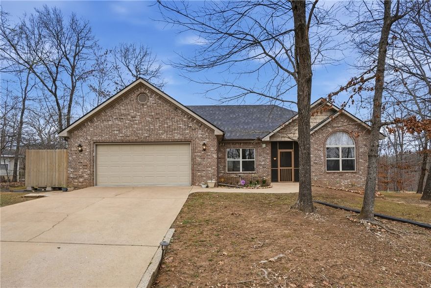 Purchased Brand New. One Owner. Flat Lot, All Brick, Paved Road. Wooded Views Front and Rear. Flat Driveway, Newer Roof, Regularly Maintained HVAC, over half acre of usable land with 3 sides road right away, Insulated Garage. Highly Desirable Neighborhood, Newer Homes, Quiet, Peaceful. Split floor plan, almost all Ten foot Ceilings, one cathedral and one tray ceiling. Tiered wood cabinets with crown molding. Bentonville Schools. Four Bedroom Septic on a three-bedroom home. Newer Reverse Osmosis at kitchen sink. Clean, Agent Loved and Owned.  Home has always been kept clean and maintained by Owner. Replaced all Exterior screens, complete interior repaint and all carpet replace with solid surface floors.