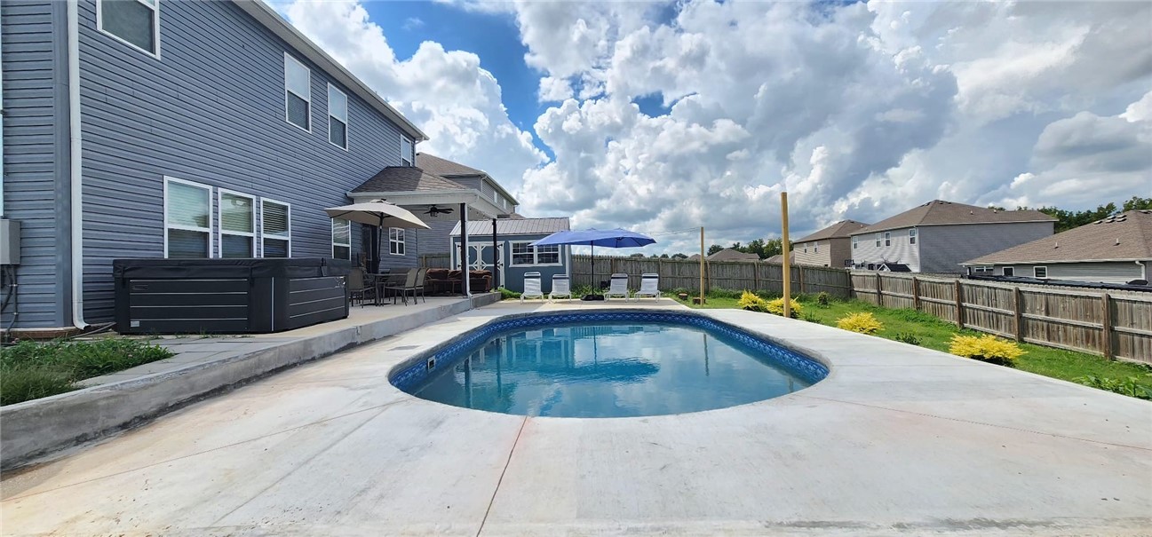 Double-sized lot and pool then some! You have to see this back yard to believe it. Such a well-maintained home it feels like new. Plenty of room inside and out for entertaining or working from home, with 4 bedrooms and a large loft area upstairs. Huge, open feel from the living room to the dining area and spacious kitchen. Tons of extra storage throughout the house, but there’s also a nice, matching outdoor storage unit too! Don’t wait on this one, schedule an appointment now!