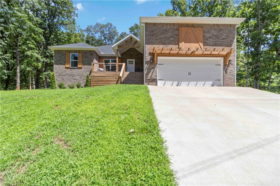 Welcome to this meticulously maintained 3-bedroom, 2-bath home offering 1,692 sq. ft. of comfortable and stylish living space. Practically brand new, this home features beautiful LVP flooring throughout and granite countertops that highlight the modern kitchen. Step out onto the fully screened back porch, the perfect spot to relax and enjoy the abundant wildlife in your own backyard. With no neighbors in sight, youāll experience peace and privacy while still having direct access to the Back 40 bike trail right from your front door. A rare find in Bella Vista, this property features an open, flat backyardāideal for entertaining, gardening, or simply soaking up the quiet natural surroundings. Located just 10 minutes from Pea Ridge and 10 minutes from the Pineville Walmart, this home combines convenience with the serenity of nature.Donāt miss your chance to own this like-new home in an unbeatable location!