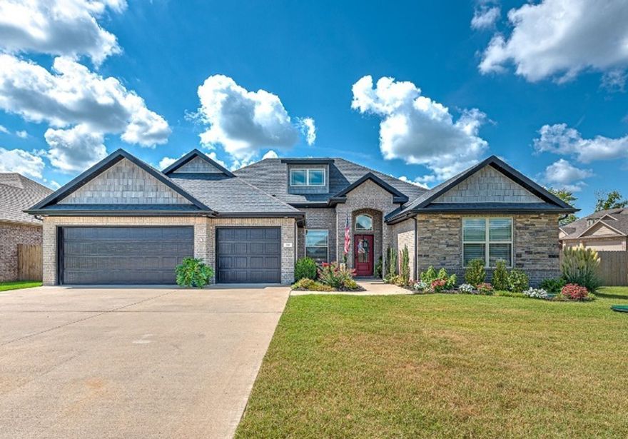 Experience refined living in this stunning 4-bedroom, 3-bath home with a private office, perfectly situated on a premium corner lot in the desirable Fairway Valley community of Cave Springs. Just minutes from The Creeks Golf Course, this home captures the ideal balance of sophistication, comfort, and convenience. Step inside to an open-concept design that exudes style and functionality — featuring dual kitchen islands, a massive walk-in pantry, and elegant black honed granite countertops highlighted by a custom tile backsplash. The inviting living room showcases a modern tile fireplace, creating the perfect space to gather and unwind. Your owner’s suite is a true sanctuary, complete with a frameless glass shower, lifetime-guaranteed onyx base, and an expansive walk-through closet that connects seamlessly to the laundry room. Set in a vibrant, walkable community close to parks, top-rated schools, and all the amenities of Northwest Arkansas — this is luxury living at its finest.