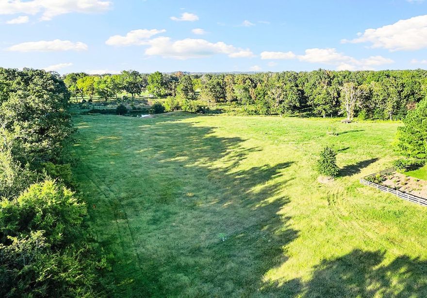 5 hilltop acres in one of the most idyllic spots in Arkansa overlooking miles and miles of scenery including the Boston mountains. This is a must-see view, come out and see it for yourself. Build your dream home and shop right here nestled in the privacy of mature trees, a private pond, open pasture and country views. For quiet country living convenient to Fayetteville, Farmington and Prairie Grove put this at the top of your list.