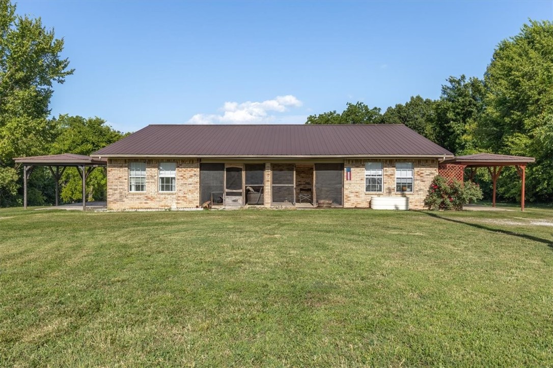 Nestled in a serene country setting yet just minutes from Springdale, Rogers, and Huntsville. This charming brick duplex with a durable metal roof offers two generous 3-bed, 2-bath units. Live in one side while renting the other, ideal for steady income and flexible living or rent them both out for income and asset appreciation. The spacious lot invites expansion with more units, gardening, or homesteading across generations. Enjoy easy access to scenic attractions: the working gristmill and iconic 1907 War Eagle Bridge on War Eagle Creek, plus miles of lush hiking, biking, horseback trails and Beaver Lake views at nearby Hobbs State Park. This property blends rural charm with smart investment and lifestyle potential.