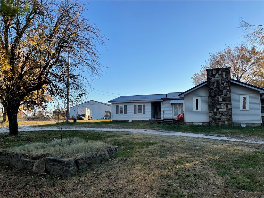 If you're willing to put in a little bit of work, this charming older home on four acres could be your dream country retreat. With over 2000 sq ft of living space, including a big, beautiful living room with a wood fireplace, there's plenty of room to stretch out and enjoy your surroundings. Plus, with a spacious 40X40 shop on the property, there's endless potential for projects and hobbies. Come see the possibilities today! Water Heater & AC Unit were replaced in 2022!