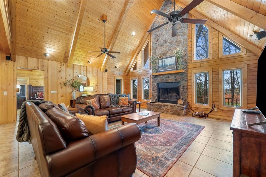 Whether you're dreaming of a STR or a forever home, this property has everything you need to relax, unwind, and enjoy natures finest. Picture it: cozy nights around the firepit, morning coffee on the deck while deer graze on the 13.58 fully fenced acres (horses previously used), tinkering in your 24x30 insulated shop or (the lack of covenants allow) hunting straight from the comfort of your wrap-around deck. Step inside & instantly be greeted by the breathtaking floor-to-ceiling stone fireplace. The open floor plan is split both on the bottom & top levels with each bedroom having its own designated bathroom. Upstairs features a loft between the 2 bedrooms that could be utilized for extra sleeping, an office, playroom, etc. The eat-in-kitchen has granite countertops and all matching appliances (new range 2022). Seclusion and beauty in one incredible package, who says you can't have it all? 

This is a very active turnkey STR. *Most* furnishings can convey with acceptable offer.