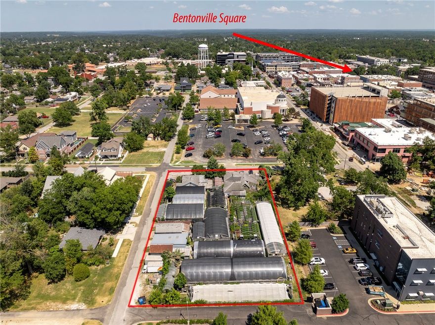 Exceptional opportunity to own a premier corner lot in the heart of Downtown Bentonville. Perfectly positioned near Skylight Cinema, the Ledger Building, and the vibrant dining and entertainment scene, this property is also just minutes from world-class mountain biking trails. With 123 feet of frontage along SW 3rd Street and 287 feet of frontage along SW B Street, it offers outstanding visibility and accessibility in one of the most dynamic markets in Northwest Arkansas. Currently operated as a flower shop and greenhouse, the true value lies in the land and the limitless possibilities for redevelopment. Just 1.5 miles from the new Walmart Home Office, this property combines a prime location with incredible potential for future growth and investment. Existing Greenhouse, and Flower shop business are NOT part of sale.