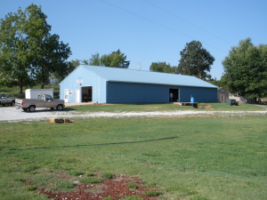 Great Commercial Warehouse / Manufacturing 4,000 Sq. Ft. building. Insulated with 2 offices and restroom, storage areas, truck dock and grade level doors. Cent. heat and air in office areas. Good turning radius and dock pad area. Heavy power for a great workshop or cabinet shop. Nice Doublewide Mobile Home on permanent foundation near back of property for home & work location and financing.